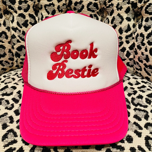 Pink and white cap with 'Book Bestie' text on a leopard print background